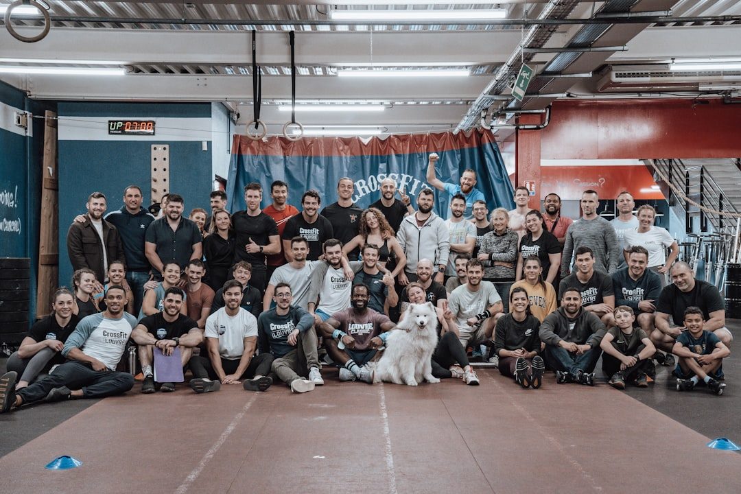 a group of people and a dog posing for a picture