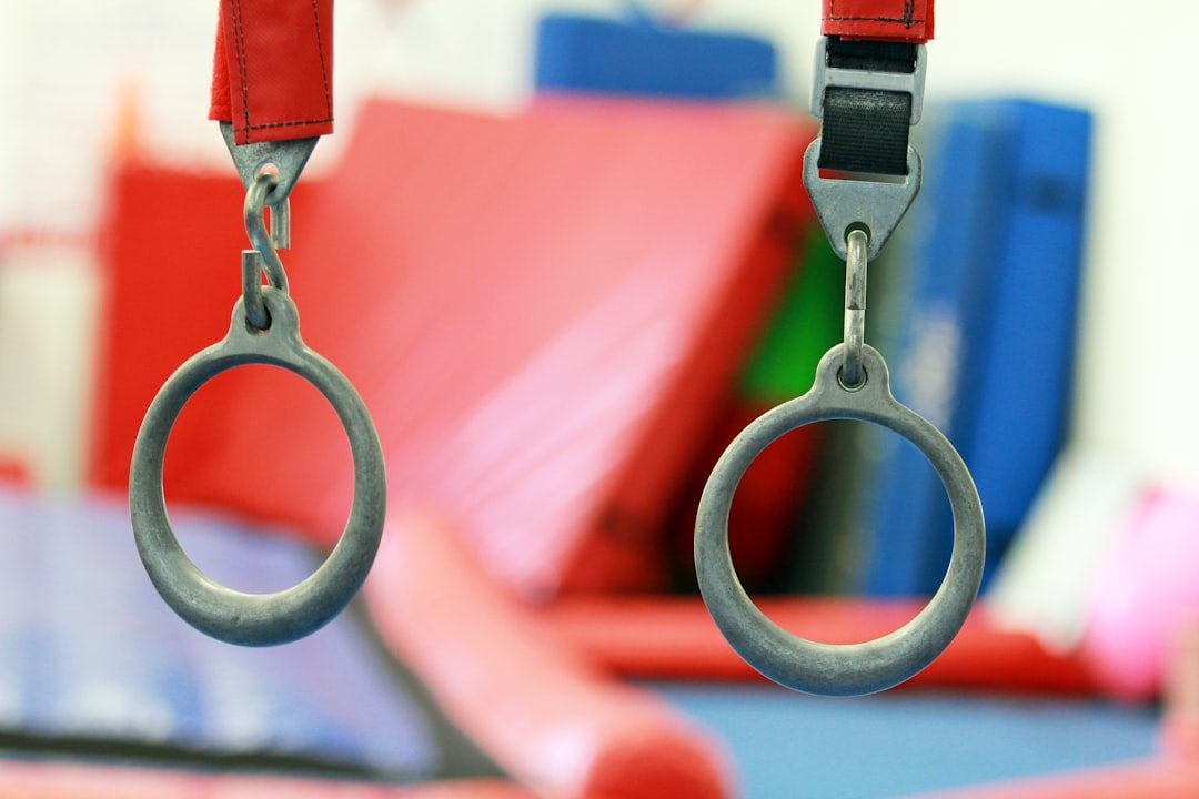 a close up of a pair of scissors hanging from a hook