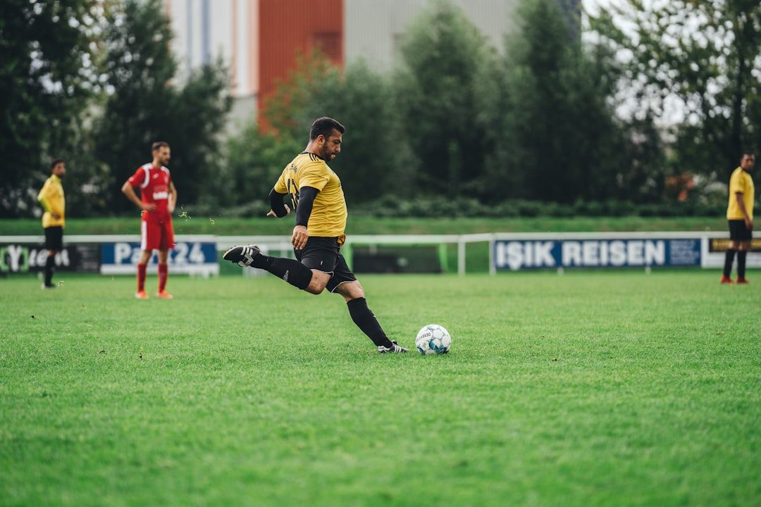 a person kicking a football ball