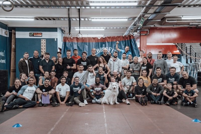 a group of people and a dog posing for a picture